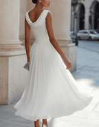 Elegant chiffon draped-neck pleated midi dress for women by Christine Brewer, featuring flowing fabric and stylish design.