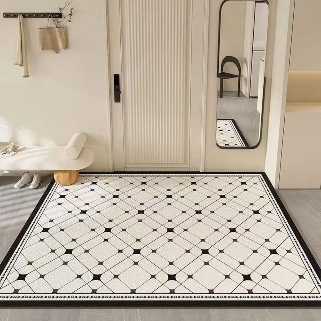 Black and white patterned rug on a floor with a mirror and wall hooks in the background.