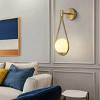 Wall light DARBE Nordic Brass Wall Light with frosted glass globe, mounted on living room wall