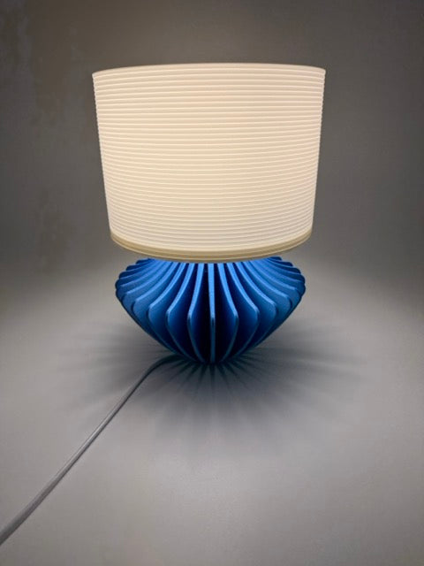 Geo Modern Table Lamp with Blue Geometric Base and White Ribbed Shade – Ambient Lighting