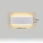 Minimalist aluminium LED wall light with up and down lighting; white rectangular fixture on wall.