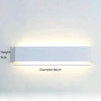 Minimalist aluminium LED wall light, white finish, wall-mounted with upward and downward glow.