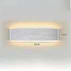 Minimalist Aluminium LED Wall Light with up and down lighting mounted on bedroom wall