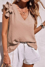 Women's v-neck top with ruffle sleeves by Christine Brewer, shown in a stylish, casual design suitable for everyday wear.