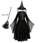 Black gothic lace dress with witch hat and toy broom