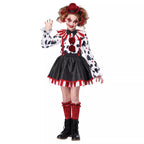 Girl wearing clown costume with black skirt and polka dot top