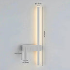 SVEA – Swivel LED Wall Light – Modern Nordic Reading Lamp for Bedroom, white finish wall-mounted with warm LED glow.