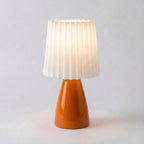 scandinavian ceramic pleated table lamp in orange