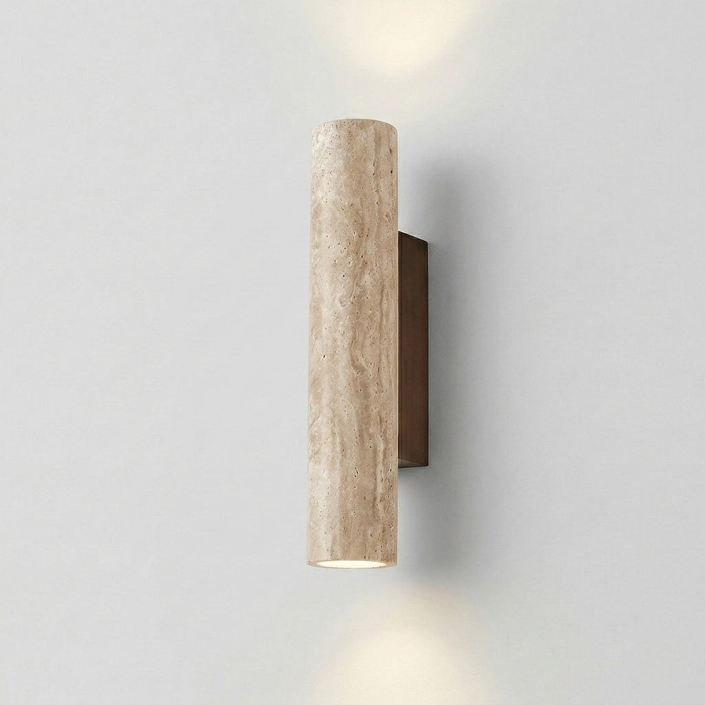 Cylindrical wall light fixture on a plain wall