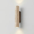 Cylindrical wall light fixture on a plain wall