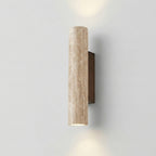 Cylindrical wall light fixture on a plain wall