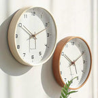 Nordic Wooden Wall Clock - Minimalist Silent Timepiece: two cream and brown wooden-framed clocks on a light wall