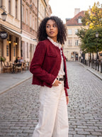 Close up view of the Womens Textured Autumn Jacket showing its intricate fabric texture and refined stitching details against a soft neutral background.