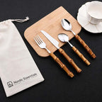 24-Piece Bamboo Handle Cutlery Set in Stainless Steel: bamboo-handled utensils on board with Nordic Essentials pouch