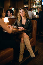 Women's Over-the-Knee Boots Draped in Beige — lifestyle restaurant