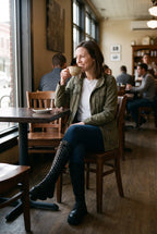 Women's Long Boots Modern in Black — lifestyle caf window
