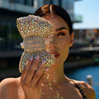 Elegant clutch bag in a soft fabric, featuring sleek design with subtle sheen and clasp closure — view 5 — view 5