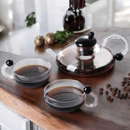 glass teapot set with cups in transparent