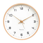 Nordic Wooden Wall Clock on white wall with wooden frame, white dial and copper hands; Made by MJK.
