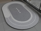 Super Absorbent Non-Slip Bath Mat gray color on bathroom floor 